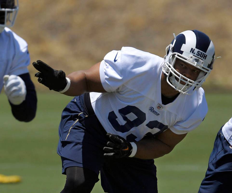 Los Angeles Rams defensive tackle Ndamukong Suh runs a play during practice at the NFL football ...