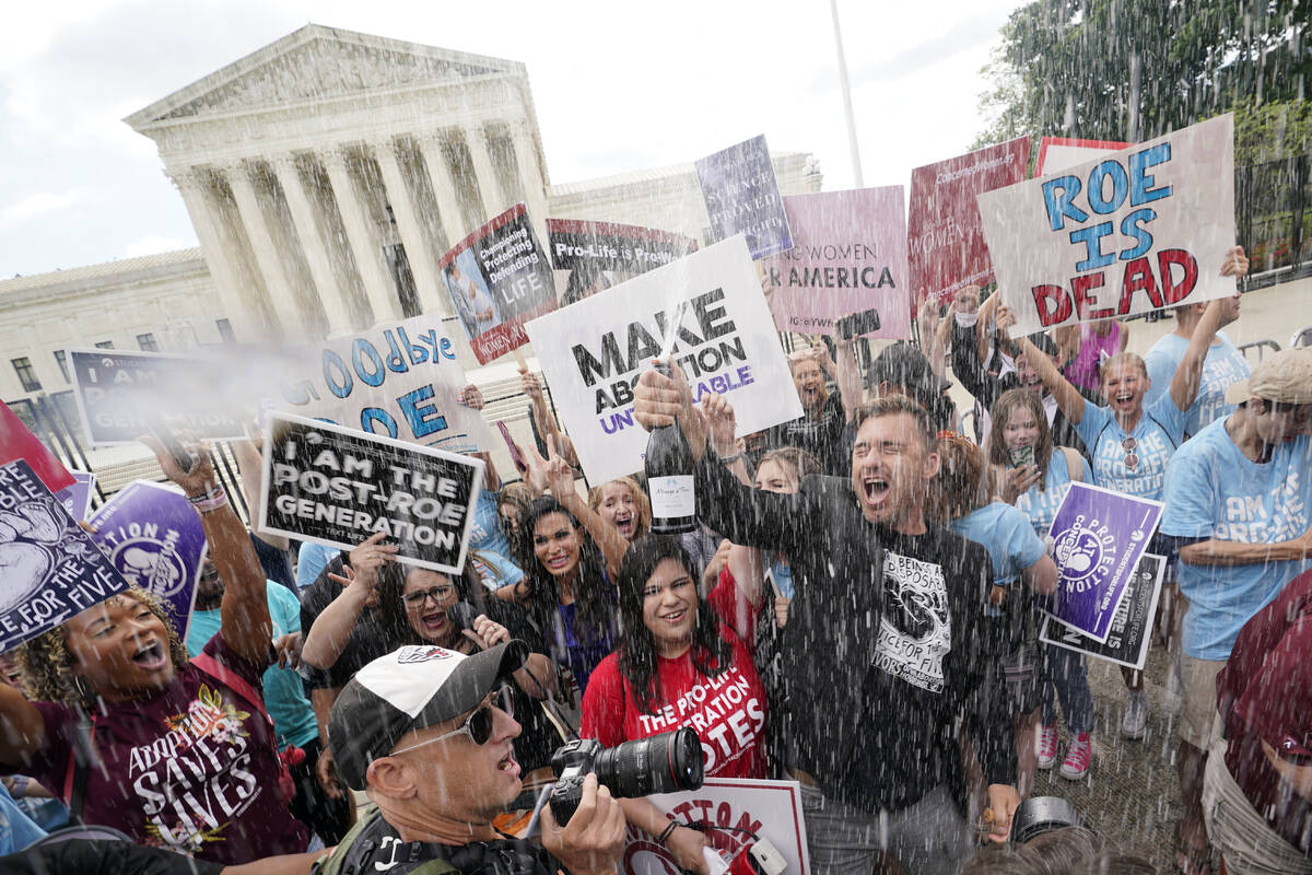 A celebration outside the Supreme Court, Friday, June 24, 2022, in Washington. The Supreme Cour ...