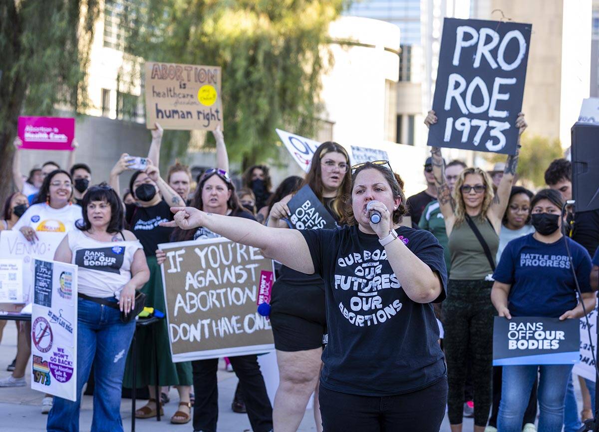 Annette Magnus with the Battleborn Progress pumps up the crowds while speaking in response to R ...