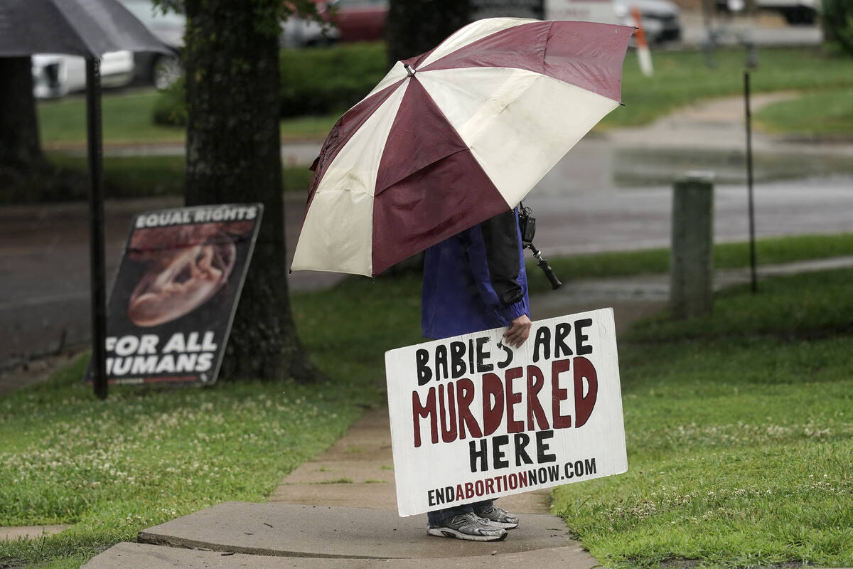 Anti-abortion advocate Clifton Boje, from Bonner Springs, Kan., stands outside the Planned Pare ...