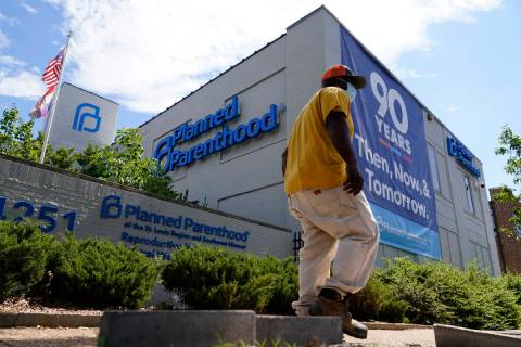 A person walks past Planned Parenthood Friday, June 24, 2022, in St. Louis. Most abortions are ...