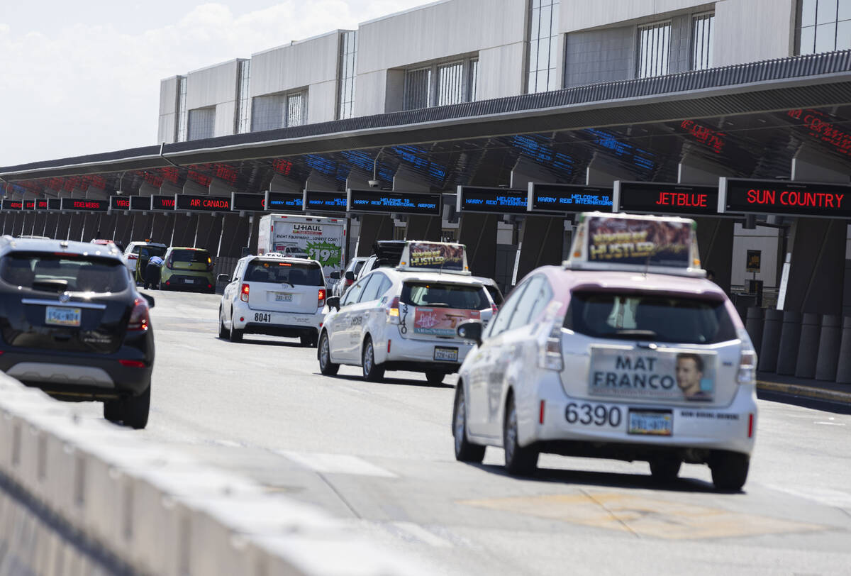 Departing passengers arrive at Terminal 3 at Harry Reid International Airport on Friday, June 2 ...