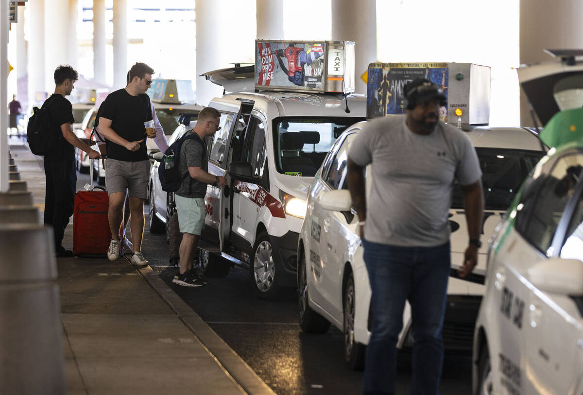 Arriving passengers take taxis at Terminal 3 at Harry Reid International Airport on Friday, Jun ...