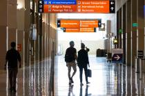 Passengers walk at Terminal 3 at Harry Reid International Airport on Friday, June 24, 2022, in ...