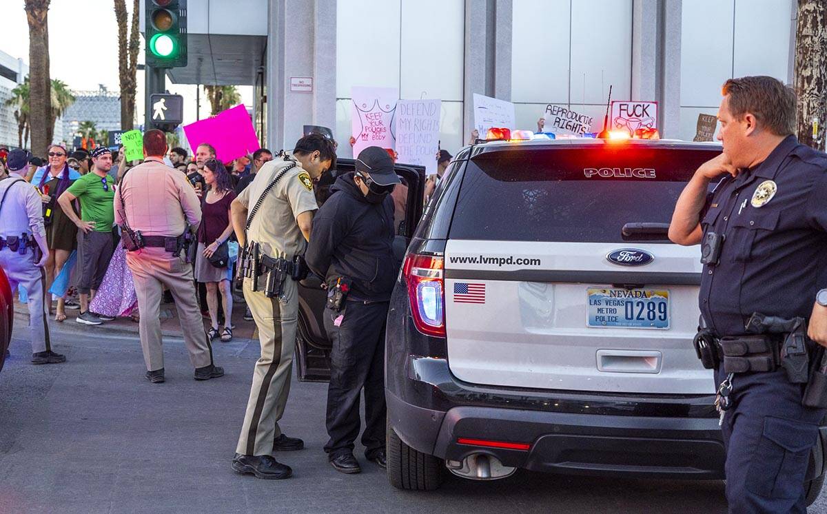 Metro arrests a protester during a march downtown in response to Roe v. Wade being overturned t ...