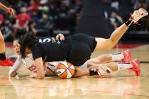 Las Vegas Aces forward Dearica Hamby (5) and Washington Mystics forward Alysha Clark (22) battl ...