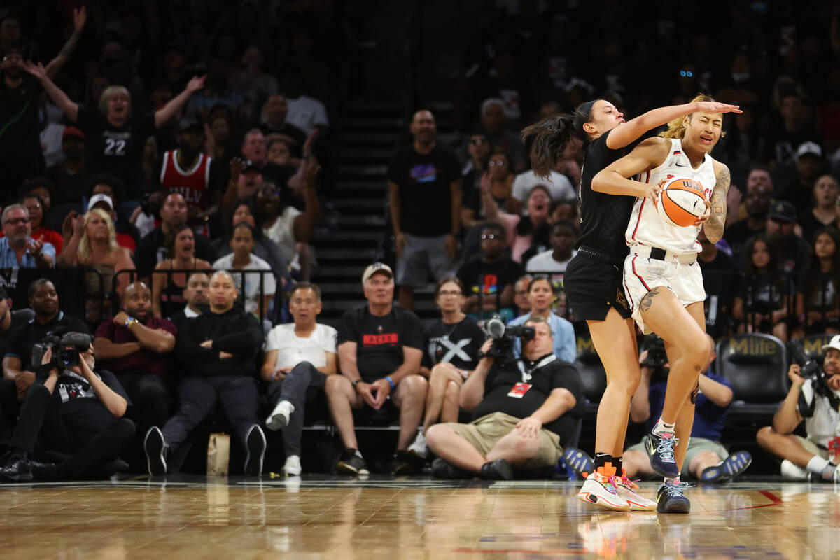 Las Vegas Aces forward Dearica Hamby (5) fouls Washington Mystics during overtime in a WNBA bas ...