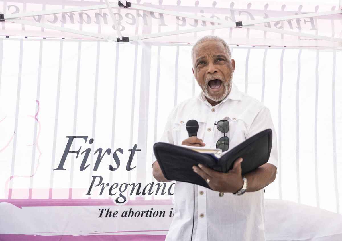 Darrell Porter reads a verse from the bible during the anti-abortion rally “Honoring our ...