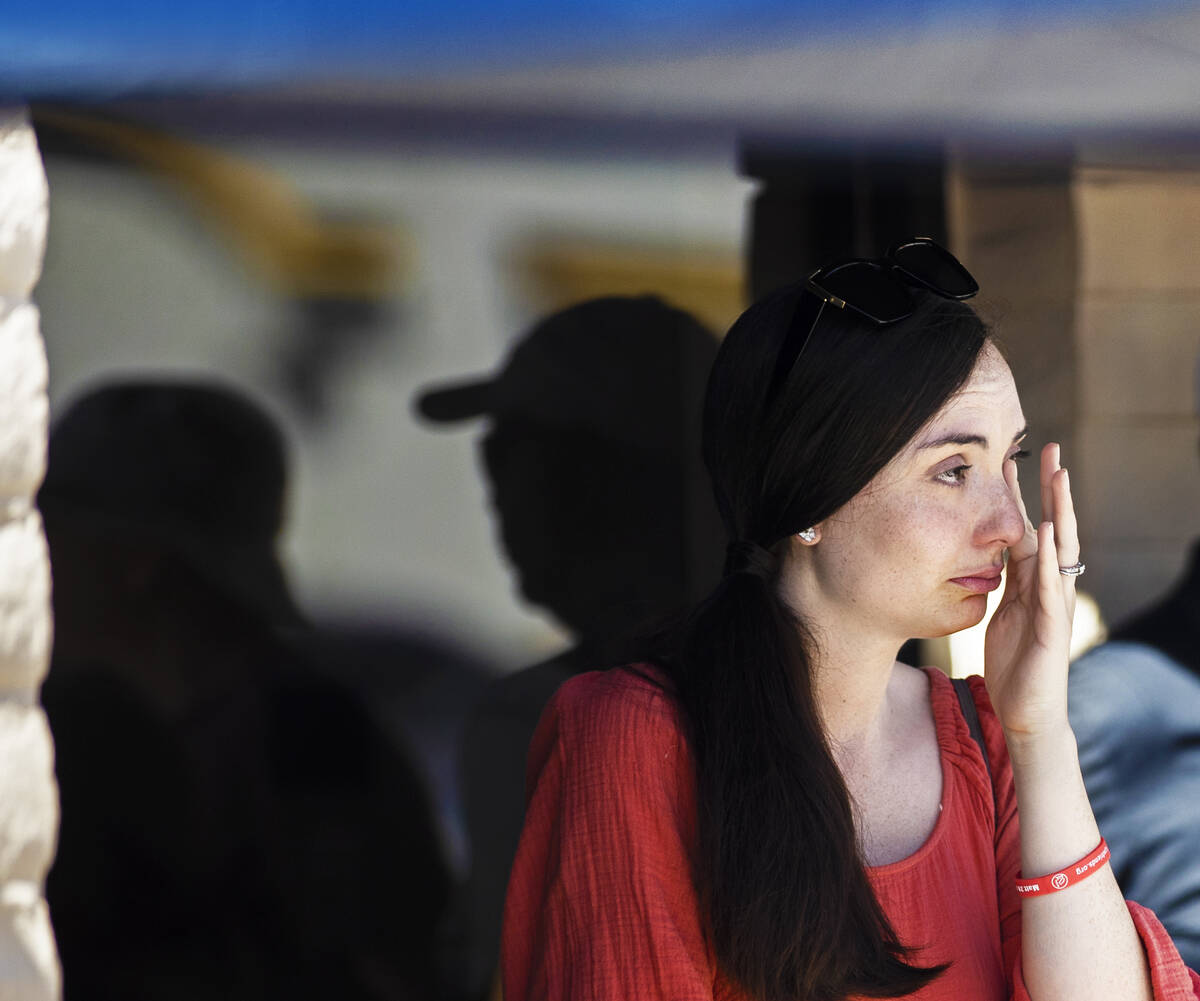 Olivia French wipes tears from her eyes during the anti-abortion rally “Honoring our For ...