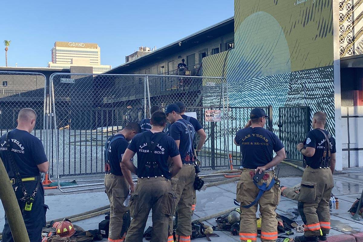 Crews battle a fire at a vacant motel Monday, June 27, 2022, near East Ogden Avenue and North 7 ...