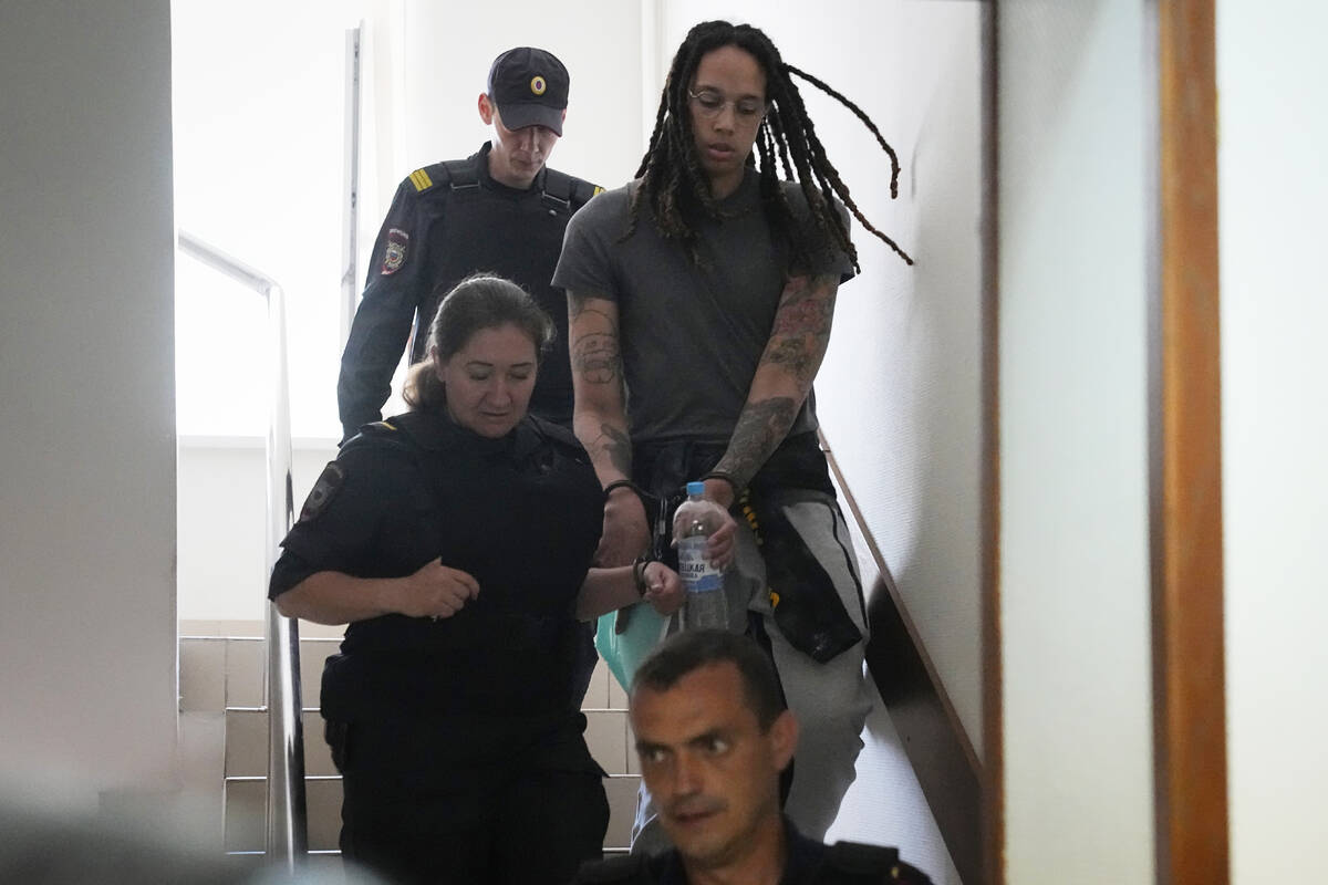 WNBA star and two-time Olympic gold medalist Brittney Griner is escorted to a courtroom for a h ...