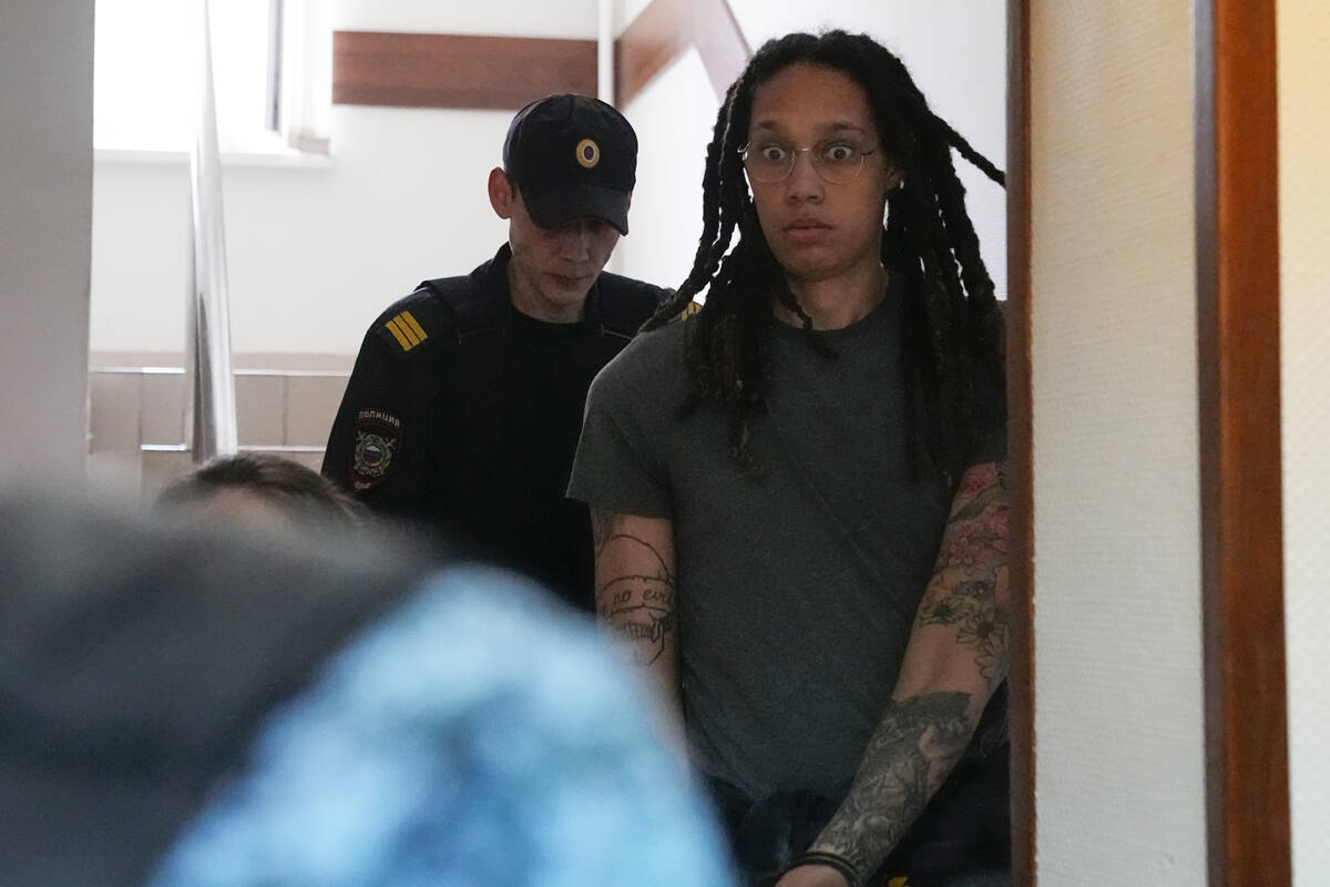 WNBA star and two-time Olympic gold medalist Brittney Griner is escorted to a courtroom for a h ...