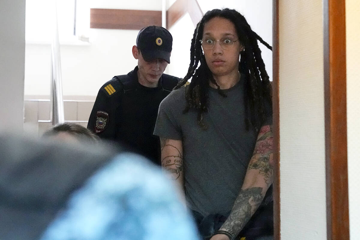 WNBA star and two-time Olympic gold medalist Brittney Griner is escorted to a courtroom for a h ...