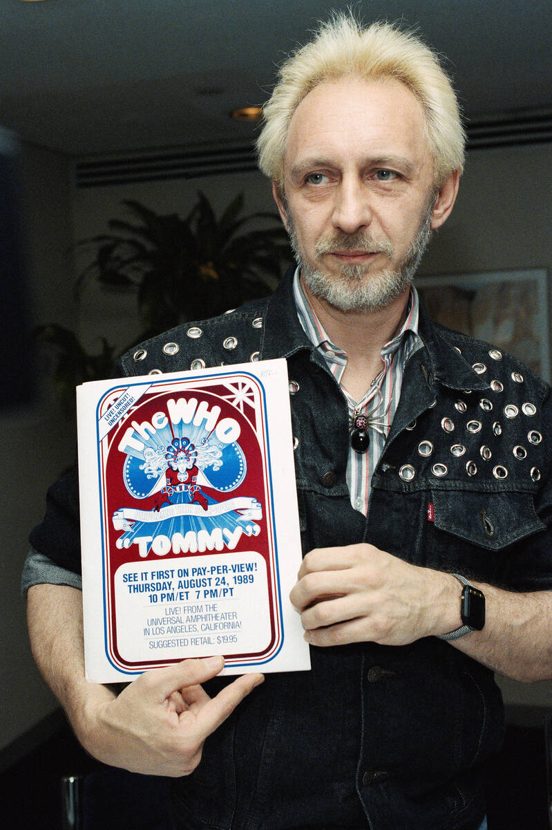 John Entwistle of The Who holds a poster on July 5, 1989, in New York for his group's upcoming ...