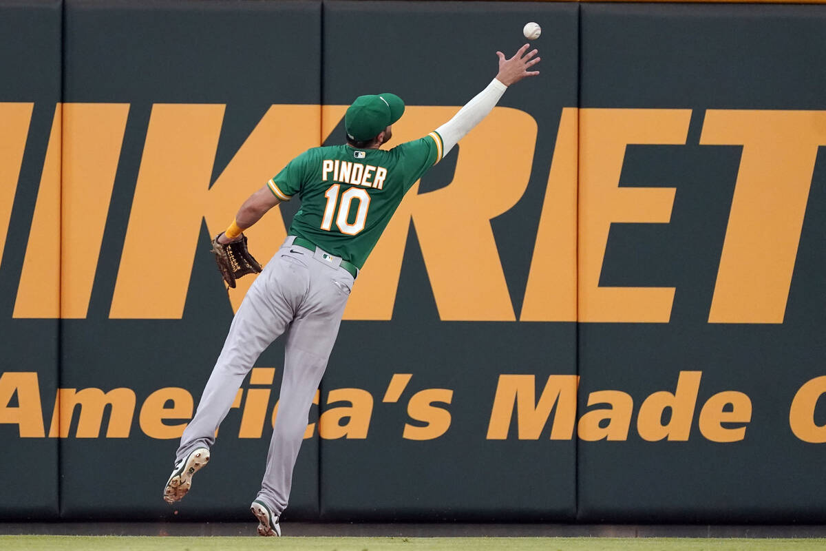 Oakland Athletics left fielder Chad Pinder (10) plays the ball off the wall on a double by Atla ...