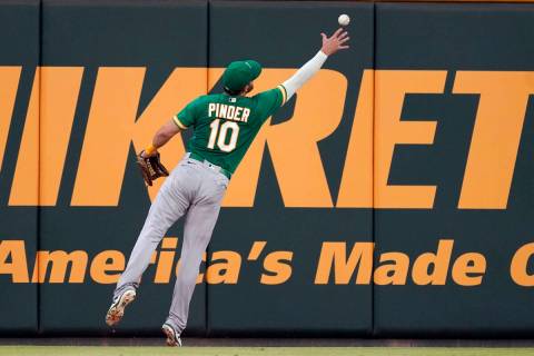 Oakland Athletics left fielder Chad Pinder (10) plays the ball off the wall on a double by Atla ...