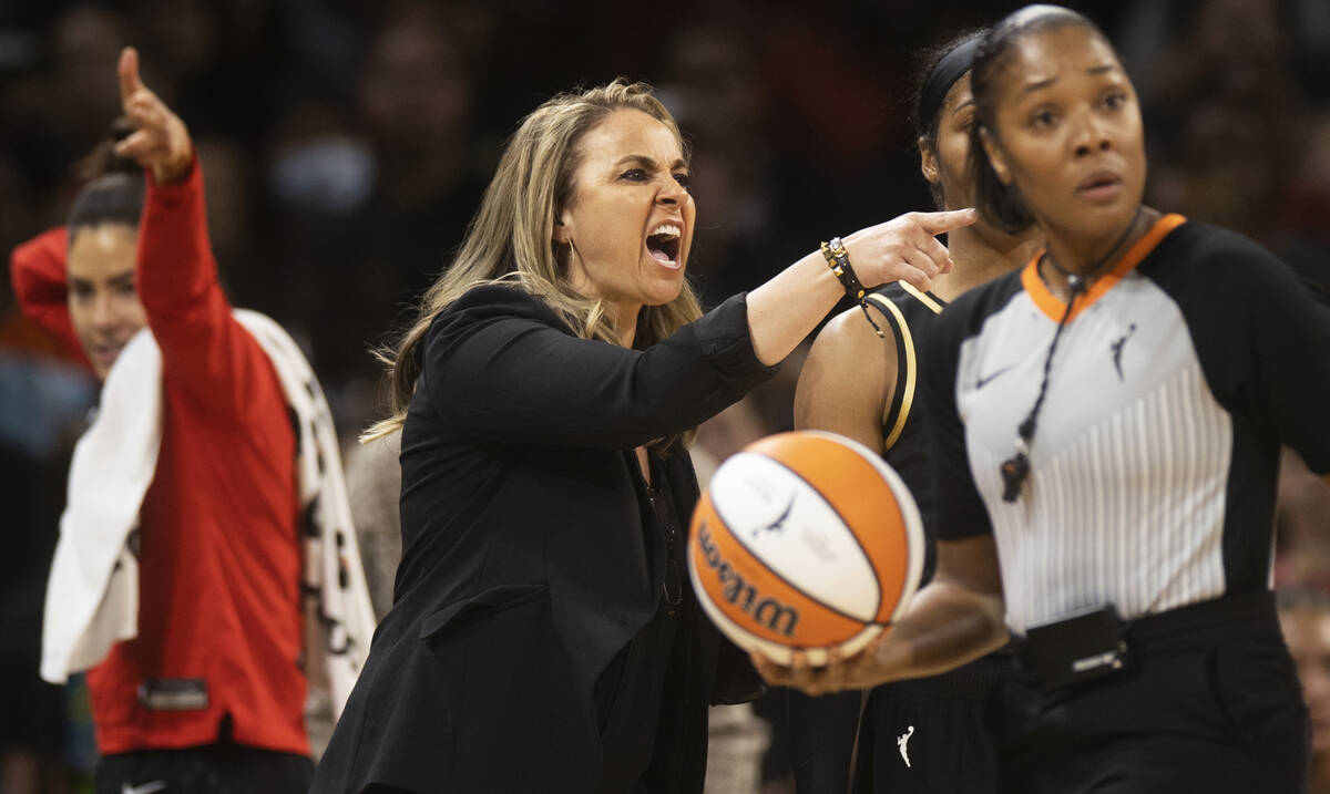 Aces head coach Becky Hammon directs her team in the second half during a WNBA basketball game ...