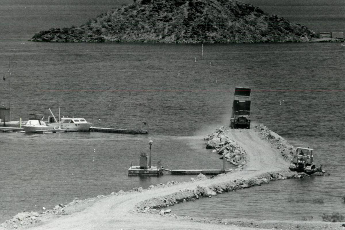 Workers rebuild a submerged road to an island near Lake Mead Marina on July 29, 1983. (Las Vega ...