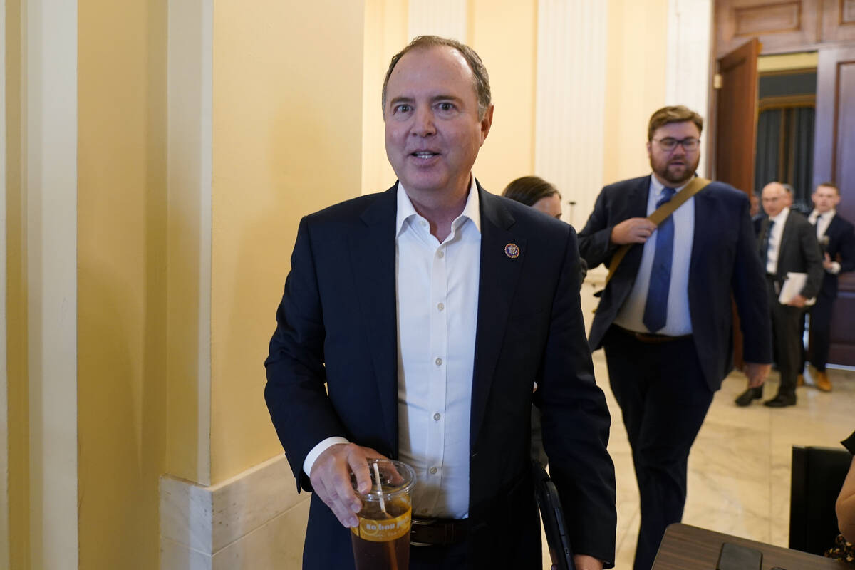 Rep. Adam Schiff, D-Calif., leaves the hearing room after preparing for today's hearing, as the ...