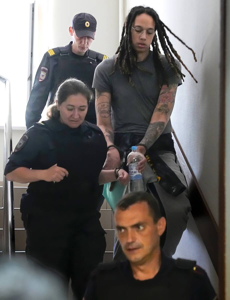 WNBA star and two-time Olympic gold medalist Brittney Griner is escorted to a courtroom for a h ...