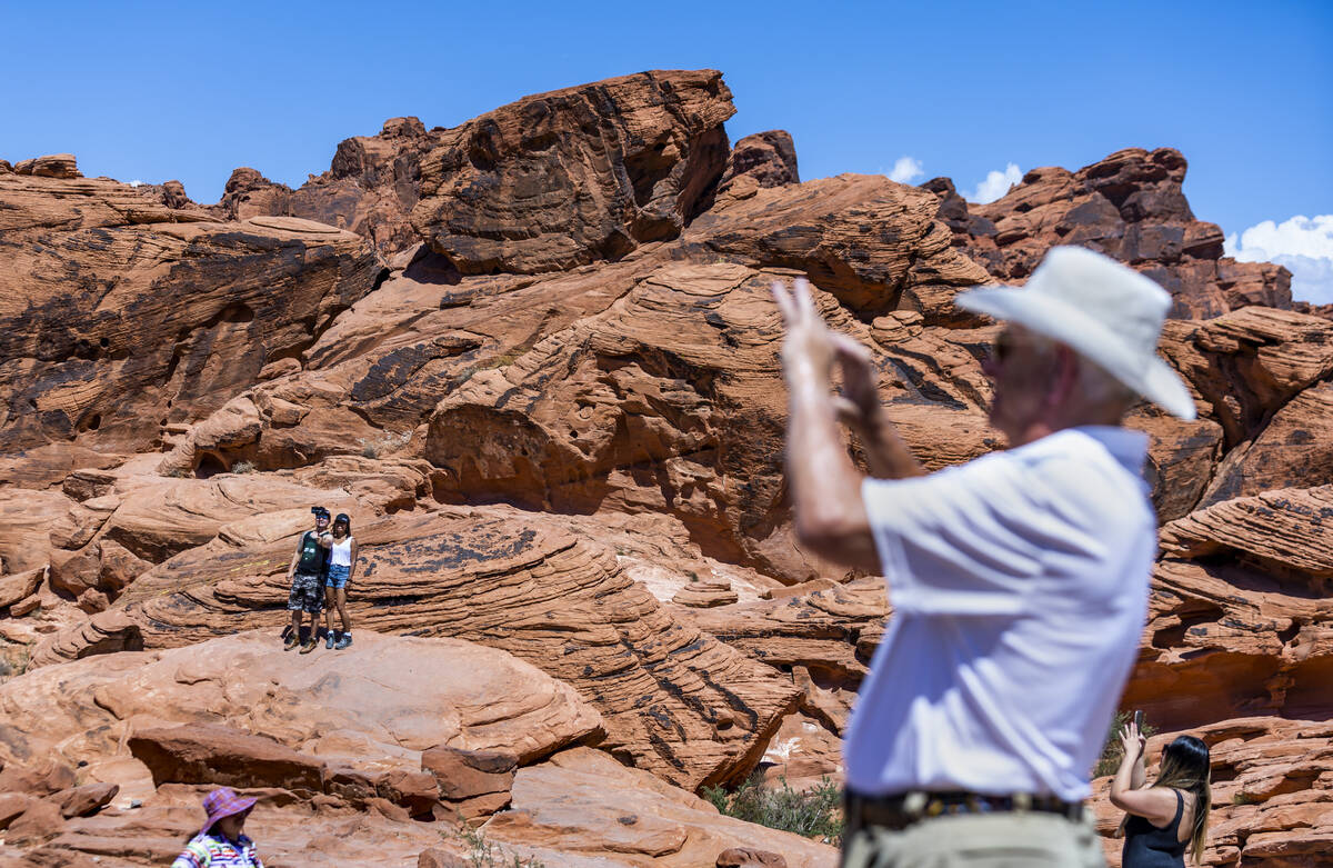 Visitors take in the Beehives rock formations in the Valley of Fire State Park on Tuesday, June ...
