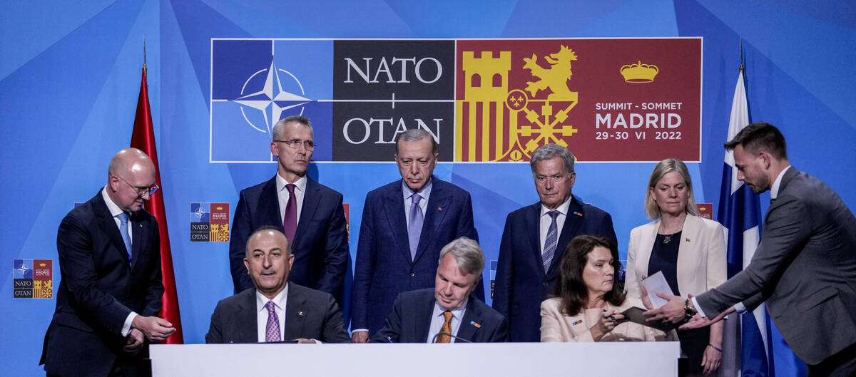 From left to right background: NATO Secretary General Jens Stoltenberg, Turkish President Recep ...