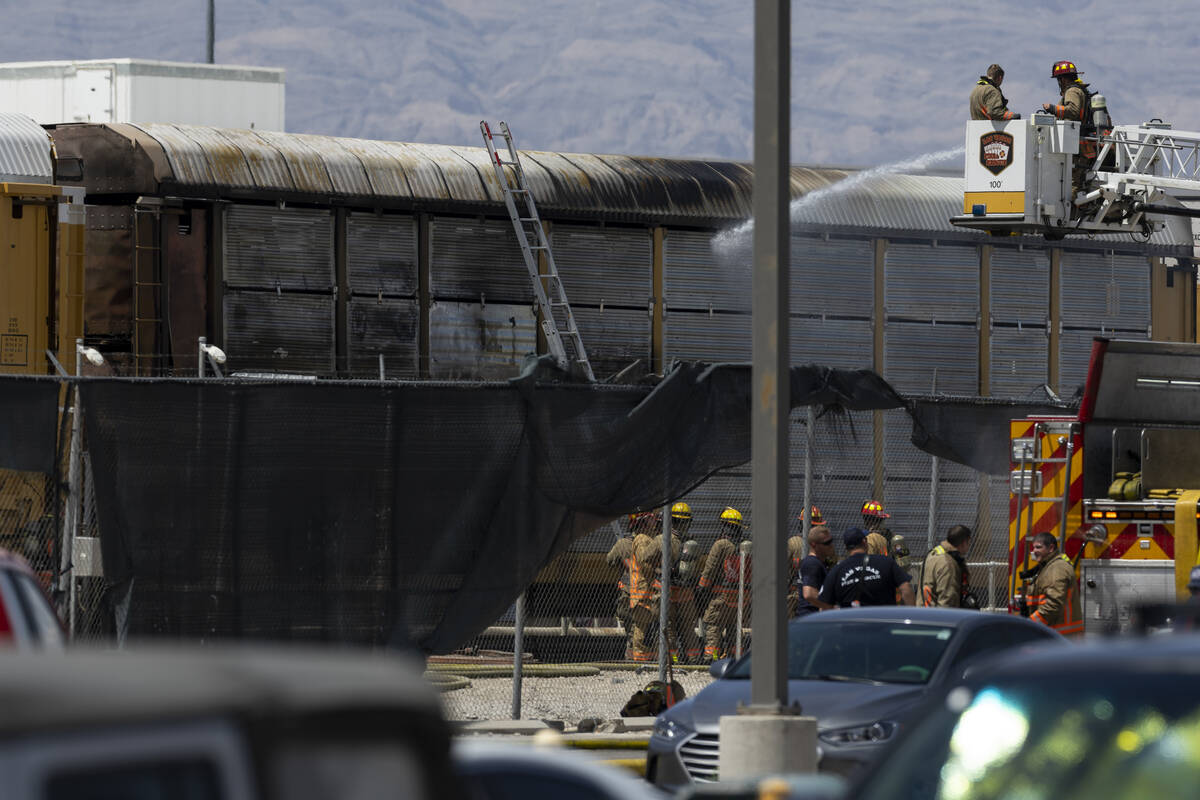 Las Vegas firefighters extinguish a train fire near Main Streets and Bonanza Road in Las Vegas, ...