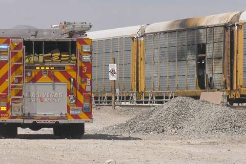 Las Vegas firefighter vehicle next to a train that caught fire near Main Streets and Bonanza Ro ...