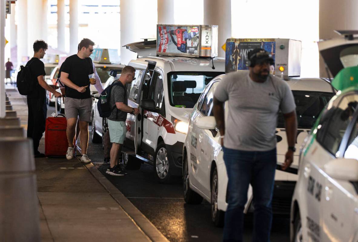 Arriving passengers take taxis at Terminal 3 at Harry Reid International Airport on Friday, Jun ...