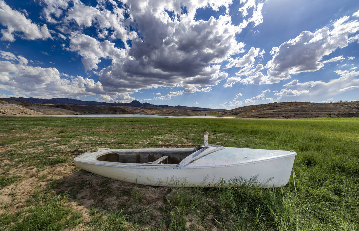 A boat is left stranded on the shoreline as water levels continue to drop at the Lake Mead Nati ...