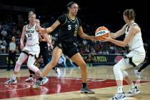 Chicago Sky guard Allie Quigley (14) looks to pass to forward Emma Meesseman (33) while Las Veg ...