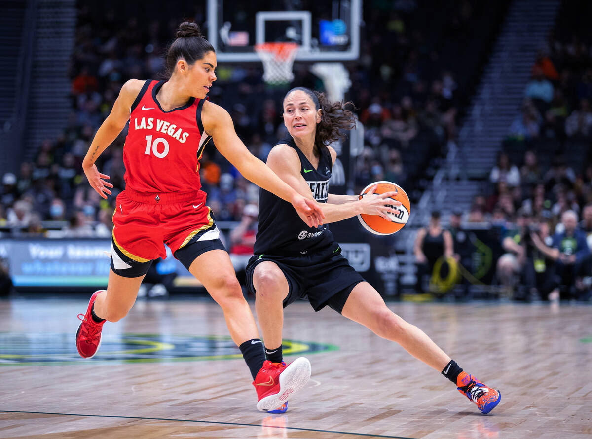 Seattle Storm's Sue Bird stops as Las Vegas Aces' Kelsey Plum defends during the first half of ...