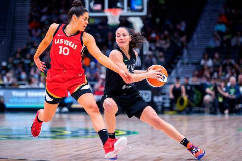 Seattle Storm's Sue Bird stops as Las Vegas Aces' Kelsey Plum defends during the first half of ...