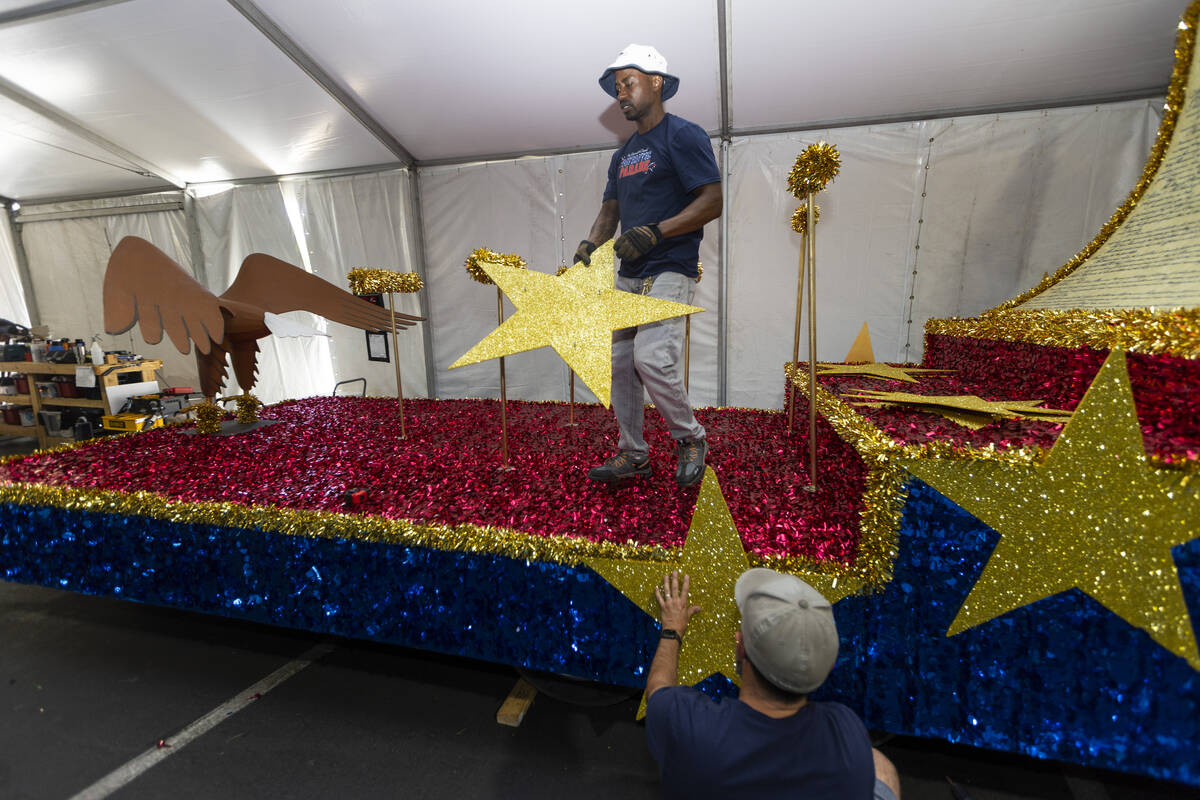 Maintenance coordinators Isiah Powell, left, and Dave Bailey put the finishing touches on a flo ...