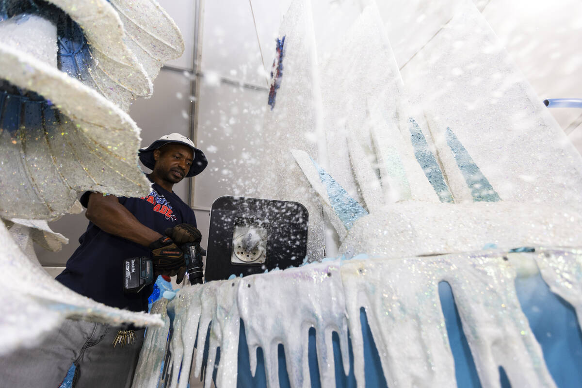 Maintenance coordinator Isiah Powell makes it snow from a float on display during a Summerlin P ...