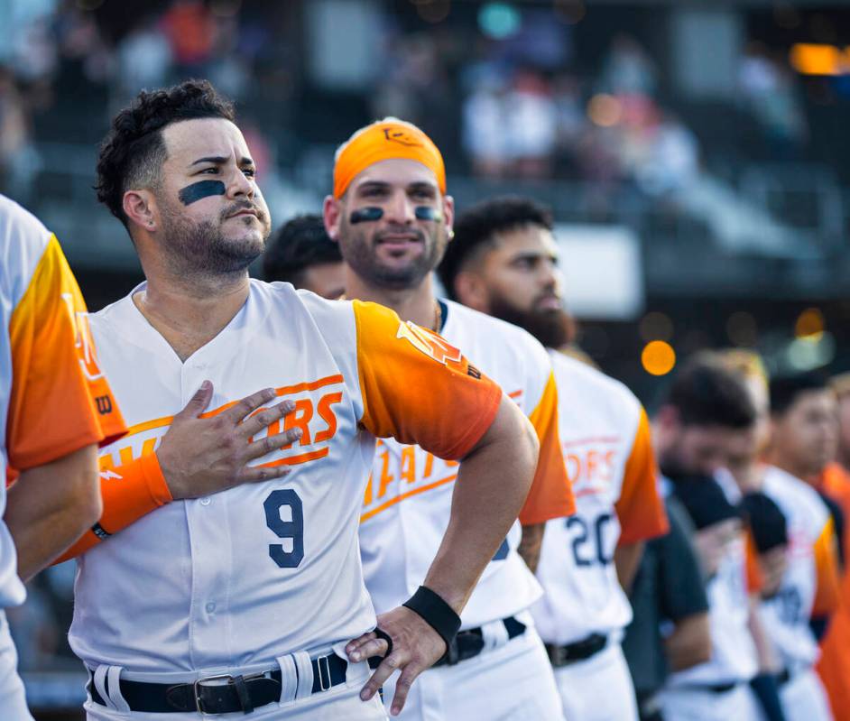 Aviators infielder Vimael Machin (9) lines up with teammates during the national anthem before ...