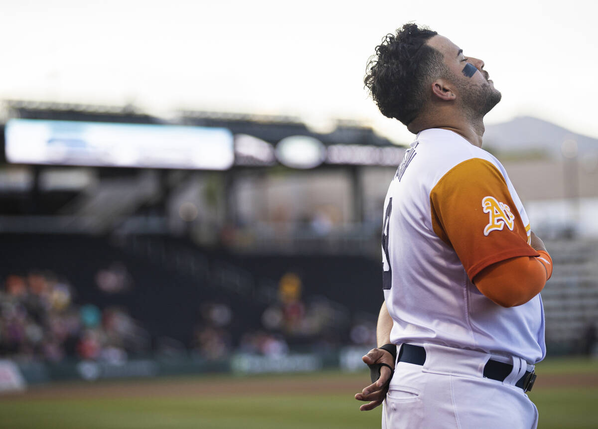 Aviators infielder Vimael Machin (9) prays before the start of a minor league baseball game aga ...