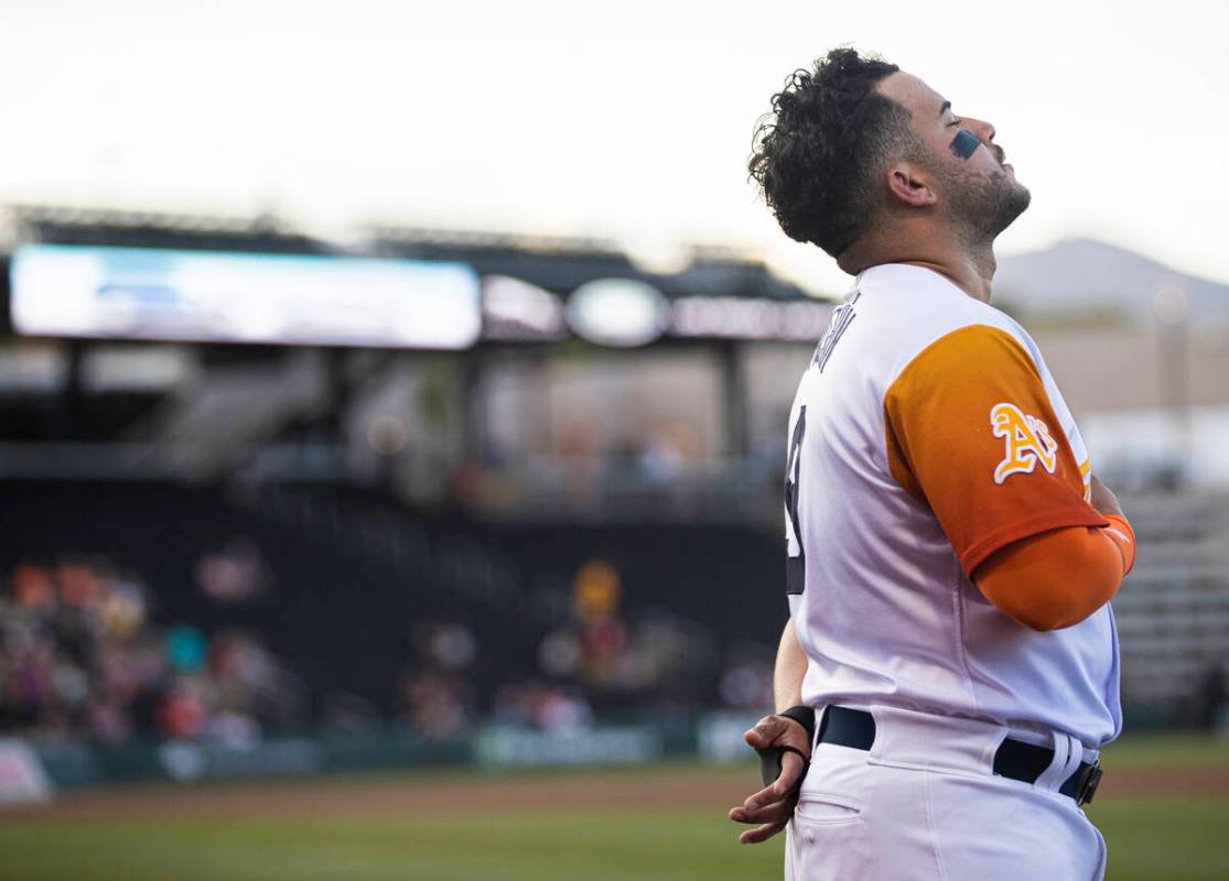Aviators infielder Vimael Machin (9) prays before the start of a minor league baseball game aga ...
