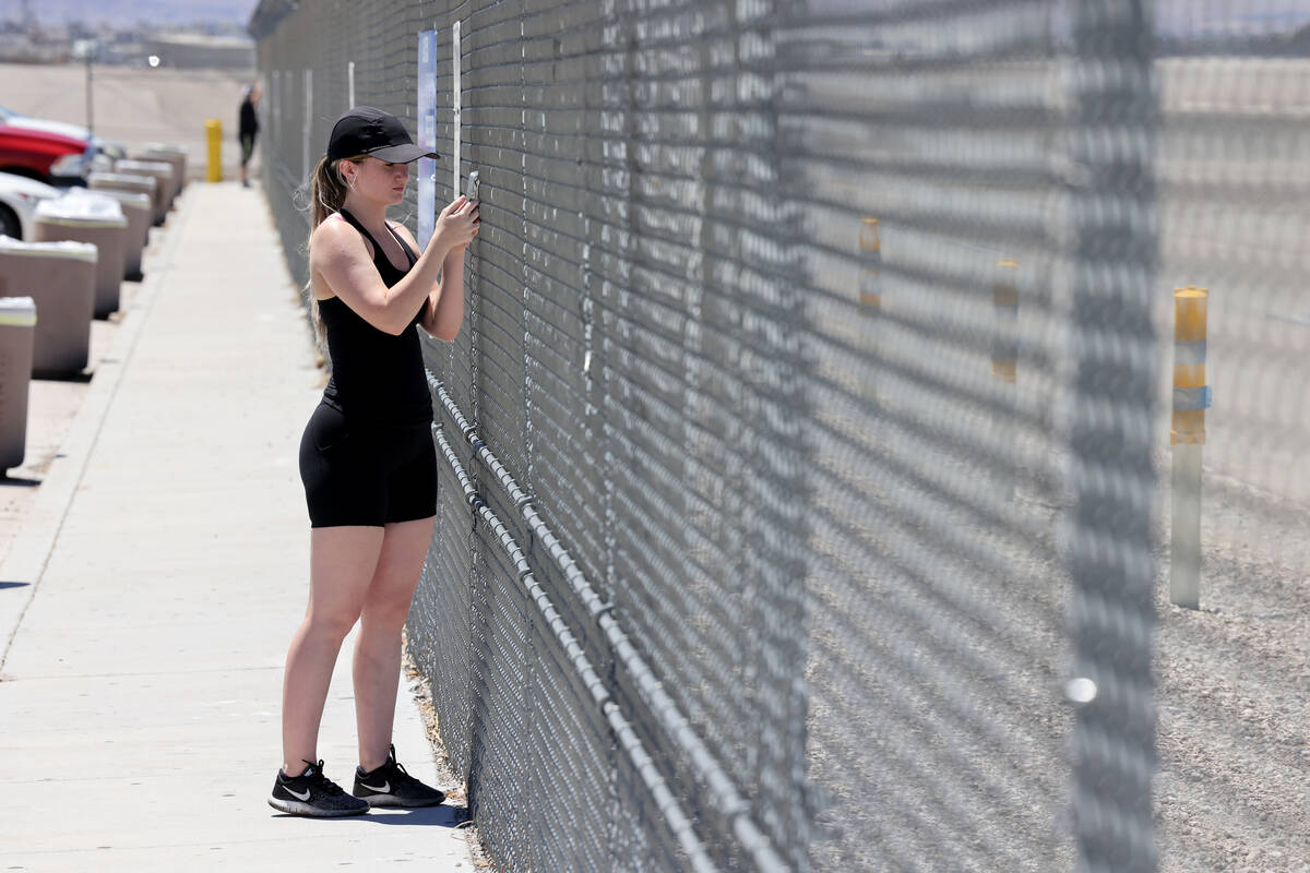 Flo McDonald of Las Vegas checks out planes at the Harry Reid International Airport viewing are ...