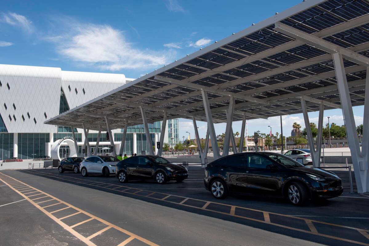 Teslas line up to pick up passengers at the Vegas Loop West Station at the Las Vegas Convention ...