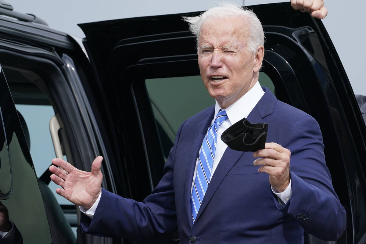 President Joe Biden responds to a question about the short term deal on debt as he arrives Air ...