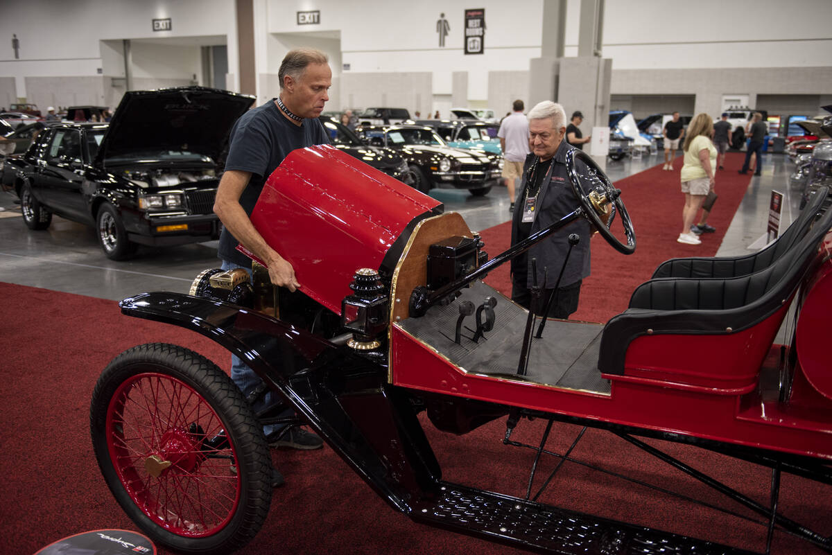 Patrick Leaderich, left, replaced the metal hood on his 1915 Model T before it goes up for auct ...