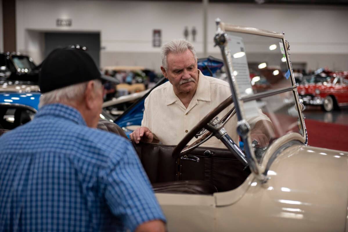 Dale Lewis, left, and Dale Gertzen check out a1920 REO T6 during opening day of the Barrett-Jac ...