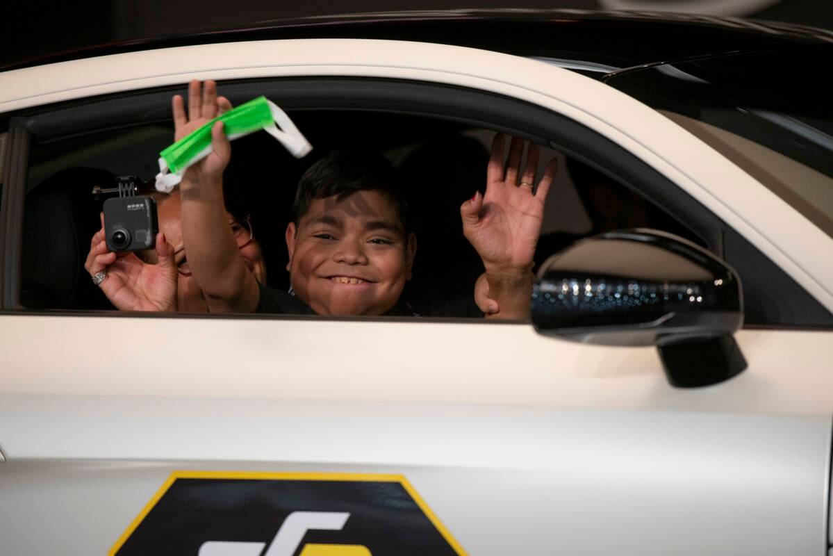 Eswin Leon Gonzalez, waves from the passenger seat of a Supercharged Audi R8 during "super ...