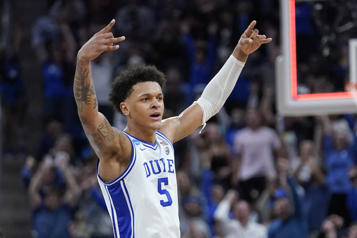 Duke forward Paolo Banchero celebrates during the first half of a college basketball game again ...