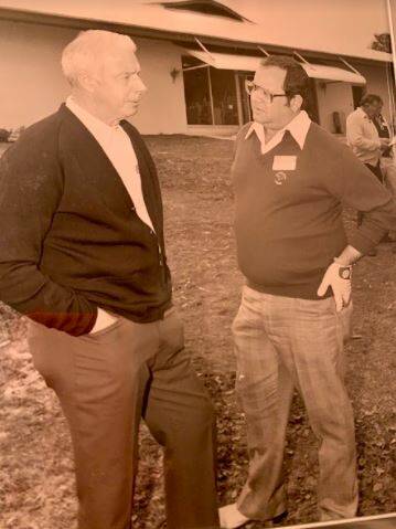 Hank Goldberg visits with Joe DiMaggio at a golf tournament. They often played golf together af ...