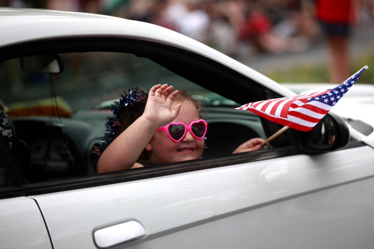 In this July 4, 2011, file photo, six-year-old Giovanna Vogt waves while riding in the 17th ann ...