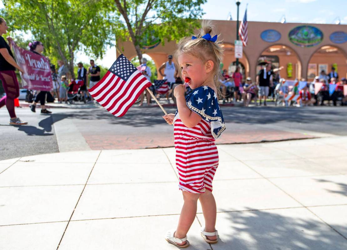In this July 3, 2021, file photo, Olivia Ruecking enjoys a treat as the parade passes down Neva ...