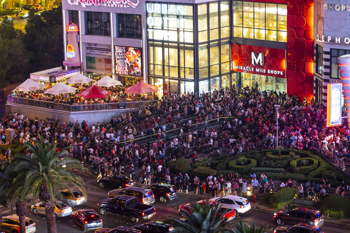 People gather to watch fireworks on the Las Vegas Strip on Sunday, July 4, 2021. (Chase Stevens ...