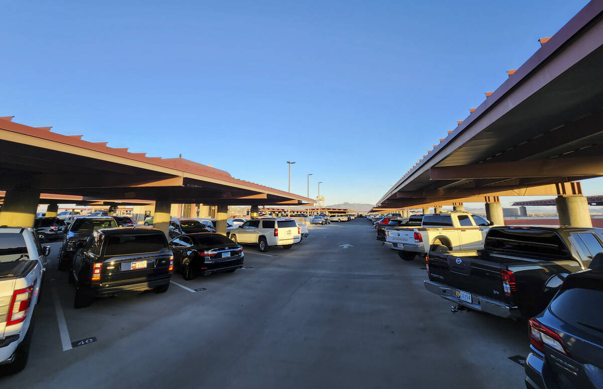 Cars fill up the top floor of long-term parking at Harry Reid International Airport on Wednesda ...